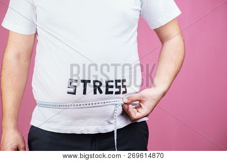 Stress, Eating Problems, Compulsive Overeating, Weight Gain. Overweight Man With Big Belly And Measu