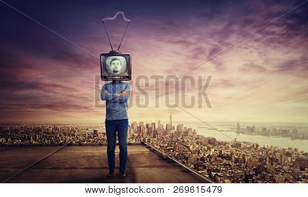 Addicted Man With Crossed Arms And Old Tv Instead Of Head Standing On Skyscraper Rooftop Over Big Ci