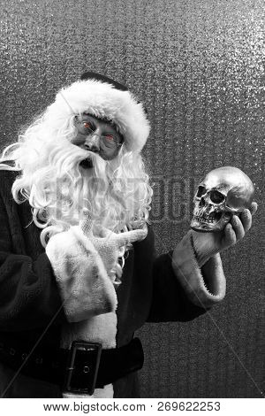 Santa Claus. Santa Preforms Shakespeare's Hamlet in black and white.  Alas, poor Yorick! I knew him well.