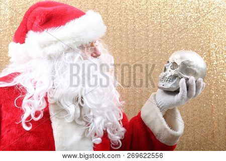 Santa Claus. Santa Preforms Shakespeare's Hamlet.  
Alas, poor Yorick! I knew him, Horatio, a fellow of infinite jest, of most excellent fancy. He hath borne me on his back a thousand times, and now,