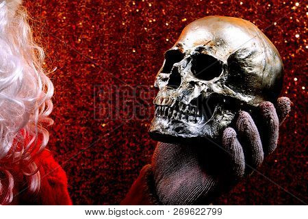 Santa Claus. Santa Claus holds a Human Skull. Santa finds an old Elf Skull. Old Man Winter is scared. Sold my soul to Santa. 