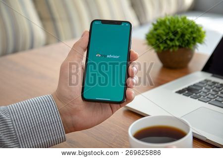 Alushta, Russia - October 8, 2018: Man Holding Iphone X With Social Networking Service Tripadvisor O