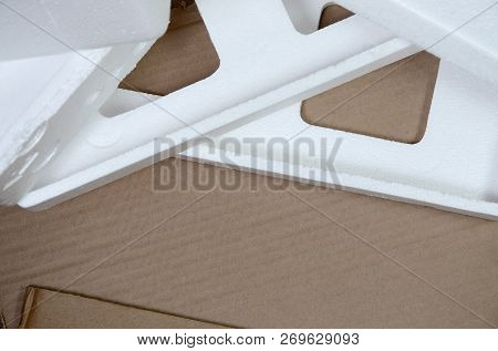 Background Image With Beige Cardboard Paper And Styrofoam Boxes Disgarded As Rubbish. The Concept Of