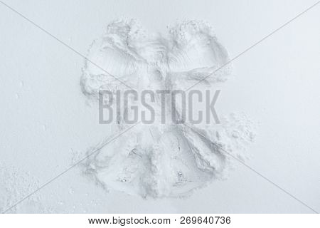 A Beautiful Snow Angel Made By A Child On Snow-white Snow.