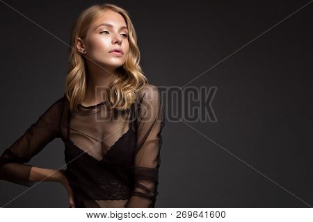 Fashion Model With Long Hair, Perfect Skin Is Posing In Studio For Glamour Test Photo Shoot Showing 
