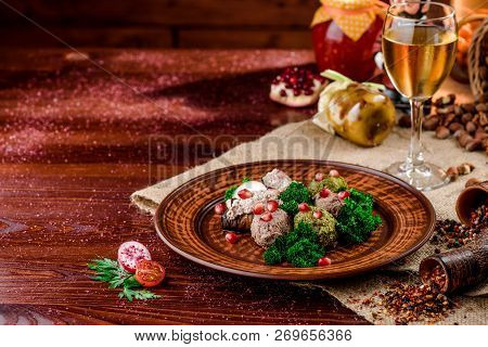 Georgian Dish - Phali Of Spinach And Meat On A Brown Plate On A Wooden Background. Close-up