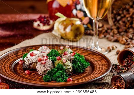 Georgian Dish - Phali Of Spinach And Meat On A Brown Plate On A Wooden Background. Close-up