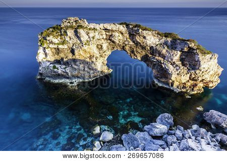 Sa Ponta, Mallorca. A Beautiful Rocky Arch In The Water