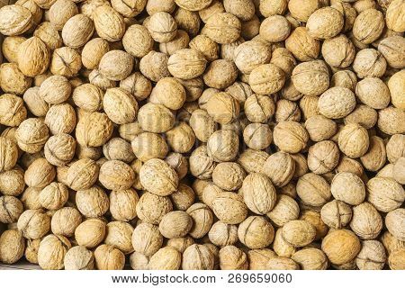 Walnuts Fruit In Shell Background Closeup. Lots Of Nuts. Stock Image Top View.