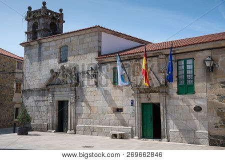 Melide, Spain - August 30, 2018: Panoramic Image Of The Town Hall In The City Center Of Melide With 