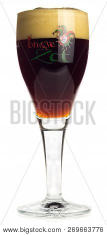 Groningen, Netherlands - November 17, 2018: Glass Of Brugse Zot Dubbel Beer Isolated On A White Back