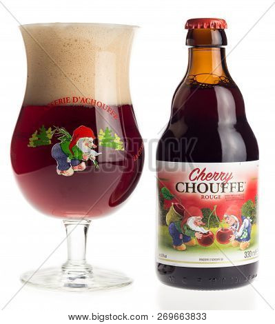 Groningen, Netherlands - November 16, 2018: Bottle And Glass Of Belgian Cherry Chouffe Beer Isolated