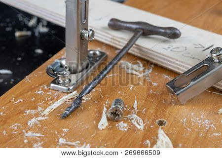 Installation Of Chipboard Furniture In A Carpentry Workshop. Accessories And Tools For Carpenters.