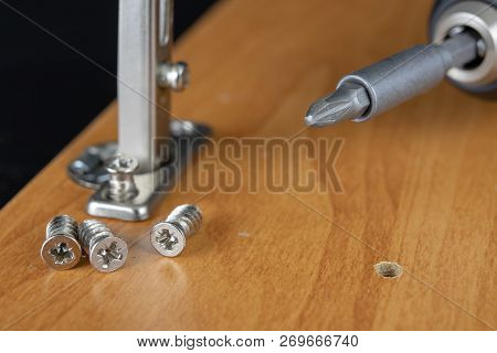 Installation Of Chipboard Furniture In A Carpentry Workshop. Accessories And Tools For Carpenters.