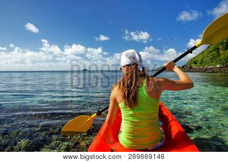 Young Woman Kayaking Near Drawaqa Island In Yasawas, Fiji. The Yasawa Group Consists Of 6 Main Islan