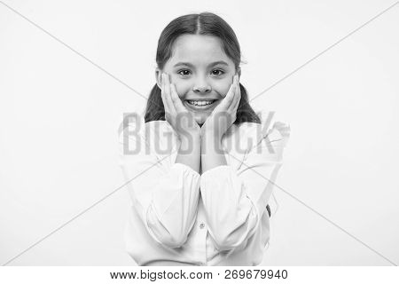 Full Of Excitement. Girl Happy Smiling Face Touches Her Cheeks Yellow Background. Schoolgirl Can Not