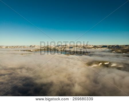 Aerial View. Hardangervidda Mountain Plateau, Norway Landscape. Morning Time, Clouds Over Lake Water