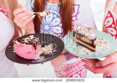 Close Up View Of Woman Holding Piece Of Homemade Cake On Plate In Hands.