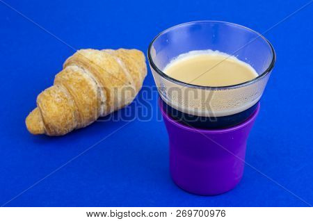 Black Coffee In Glass Cup With Croissant