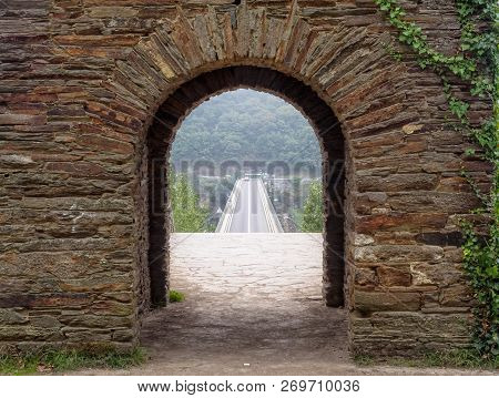 The New Bridge Over The Minho River As Seen Through An Ancient Surviving Archway In A Foggy Autumn M