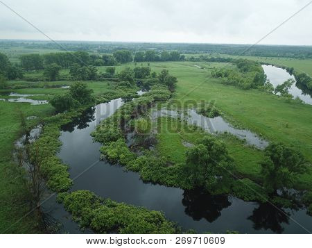 Aerial View Of The Water, Swampy Terrain And Meadows