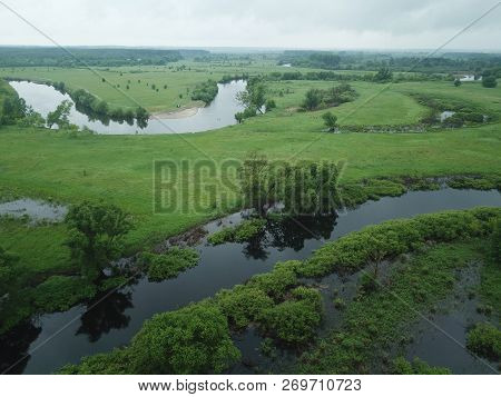 Aerial View Of The Water, Swampy Terrain And Meadows