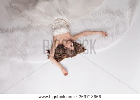 Girl In White Dress With Angel Wings On White Background. Angel-woman