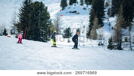 Winter Scene: A Group Of Children Are Learning To Ski