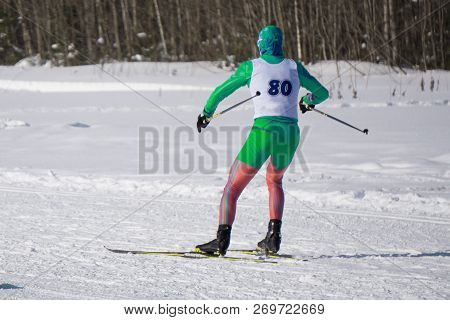 Woman Skis On Slope In Winter Day At Sports Complex