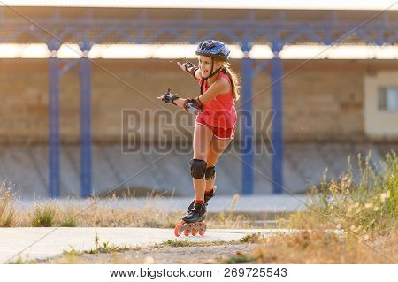 Young Teenage Girl Speed Skating On Rollerdrome