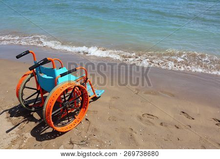 Special Wheelchair To The Beach Is Placed Near The Blue Sea