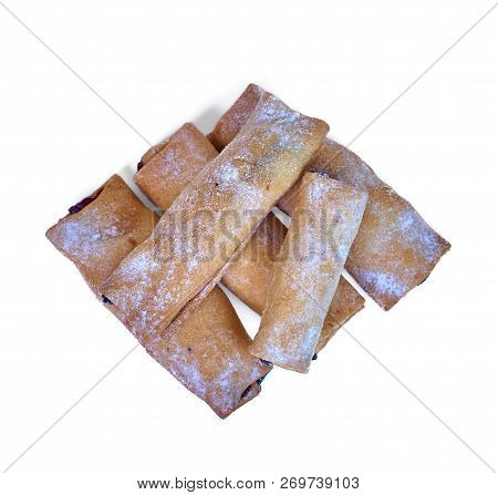 Cookies Rolled With Cherries And Black Currants Isolated On A Wh
