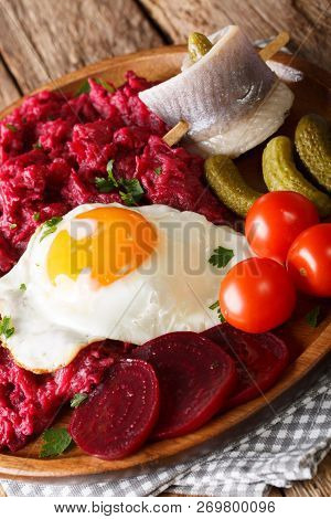 Labskaus Is A One-dish Meal Made With Mashed Potatoes, Corned Beef, And Beets And Served With A Frie