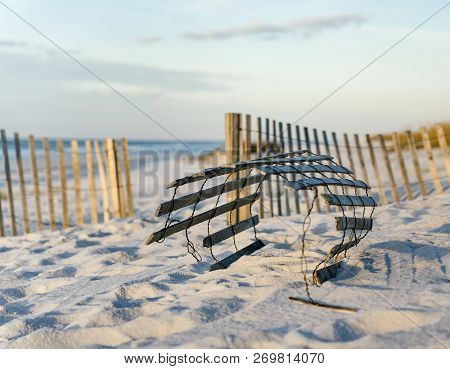 Close View Of Rolled Up Sand Fence To Help Prevent Erosion At Beautiful Florida Beach.