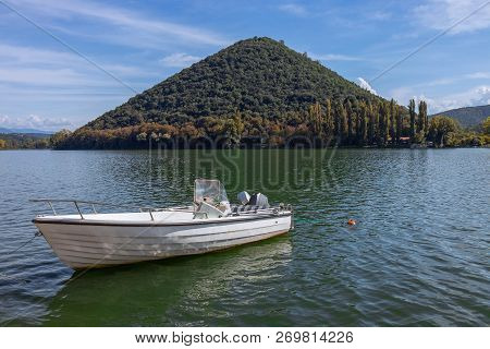 The Boat On The Lake - Piediluco, Pyramid Island In The Background. Umbria, Italy