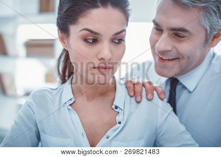 Smiling Boss Seducing His Worker At Office