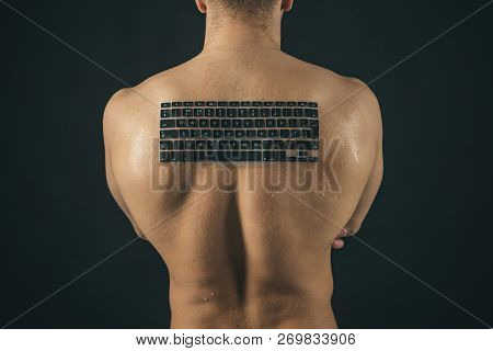 Testosterone Booster. Man Of Muscle. Man With Keyboard Keys On Muscular Back. Strong Man With Comput