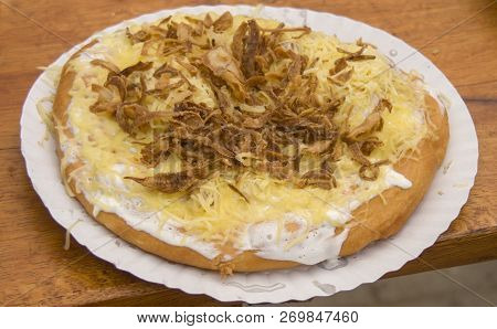 Langos Is A Hungarian Food Speciality, A Deep Fried Flat Bread Made Of A Dough With Flour, Yeast, Sa