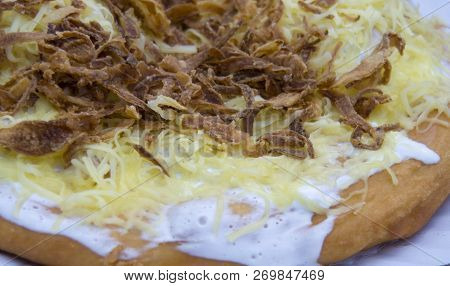 Langos Is A Hungarian Traditional Food Speciality, A Deep Fried Flat Bread Made Of A Dough With Flou