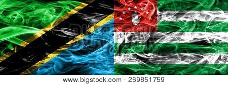 Tanzania Vs Abkhazia, Abkhazian Smoke Flags Placed Side By Side. Thick Colored Silky Smoke Flags Of 