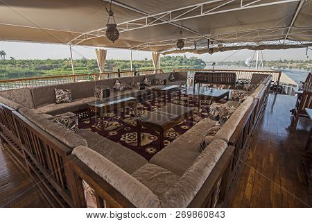 Seating Sofa And Table On The Sundeck Of A Nile River Cruise Boat With Panoramic View