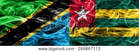 Tanzania Vs Togo, Togolese Smoke Flags Placed Side By Side. Thick Colored Silky Smoke Flags Of Tanza