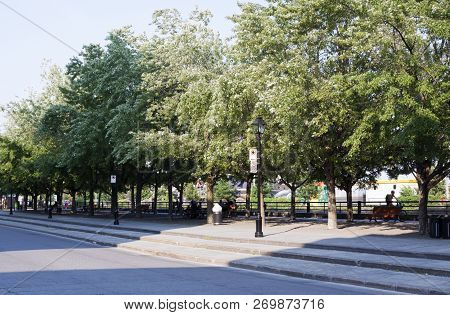 Montreal, Quebec, August 21, 2017 - Horizontal Of The Long Bike/walking Path Beside The Canal, In Ol