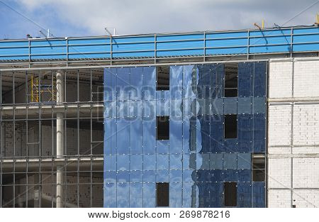 Concrete Construction, Unfinished Building And Blue Sky