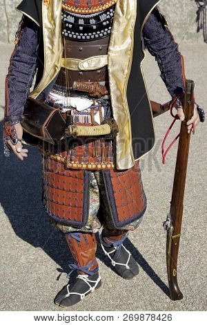 Japanese Samurai Clothing Yoroi And Kabuto Uniform With Old Rifle