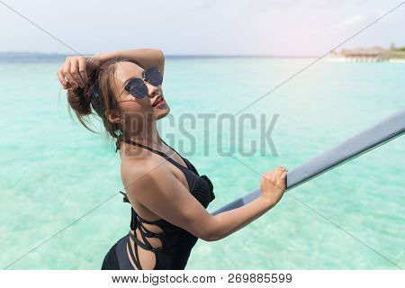Asian Sexy Woman In Black Bikini At Overwater Villa In Luxury Resport, Vacation Holidays Concepts Ba