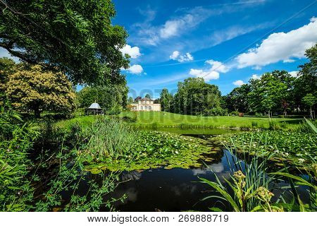 Small Castle In Beautiful Spring Surrounding,   Georgous Perspective,   Showing A Lake,   Meadows,  