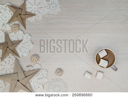 Cosy Christmas Composition With Coffee, Marshmellows, Paper Stars, Chrochet Doilies On Light Backgro