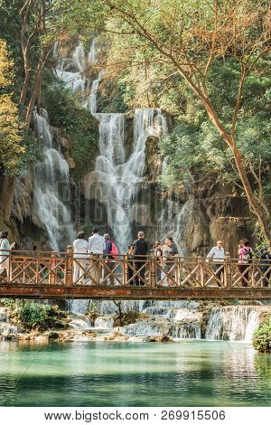 Luang Prabang, Laos - January 29, 2018: Tourists Visiting Turquoise Pools At Tat Kuang Si Waterfalls