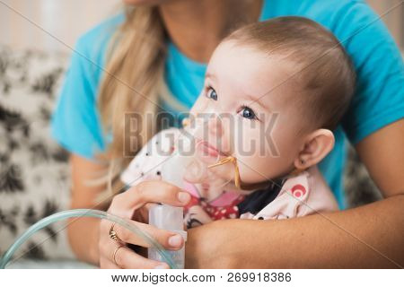 Mom Makes Inhalation Of The Child, Holding Hands